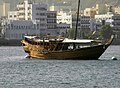 Muscat Harbor - A traditional Omani Dhow lays anchored in the Muscat Harbor (World's largest natural harbor)