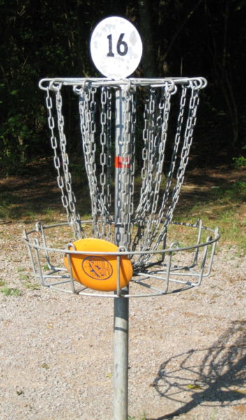 File:Disc golf in basket.JPG