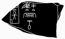 Fragment of black schist presenting Nubnefer's name beside the building "Menti Ankh" (left)