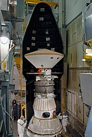 On Launch Pad 17-A at Cape Canaveral Air Force Station, the first half of the fairing is moved into place around the Phoenix Mars Lander for installation. (NASA)