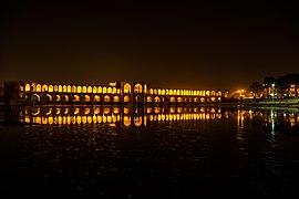 A wide view of the Khaju Bridge at night.