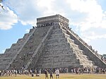 El Castillo being climbed by tourists