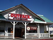 An Out West (Then T-Bird) owned Outback location at Del Amo Fashion Center in Torrance, California, in September 2007. This location was moved to the outdoor wing, with the original restaurant demolished and turned into a Marshalls location. Outback restaurant in Upland, California. Opened in 1994 as the first Outback Steakhouse in Southern California.