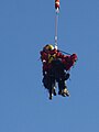 HFRS technicians landing in tandem with the aerial rescue platform.