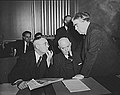 Image 30John L. Lewis (right, President of the United Mine Workers, confers with Thomas Kennedy (left), UMW Secretary-Treasurer of the UMW, and a UMW official at the War Labor Board in 1943 about a coal miners' strike.