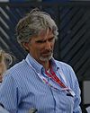 Damon Hill walking to the left of the camera