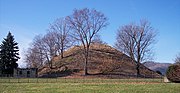 Grave Creek Mound, located in Moundsville, West Virginia, is one of the largest conical mounds in the United States. It was built by the Adena culture.