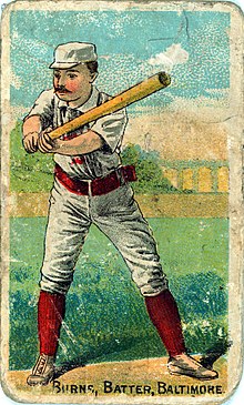 A baseball card of Oyster Burns batting in a white uniform with a red belt and socks