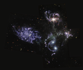 Picture of multiple galaxies in deep space.