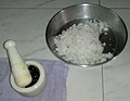 Grated Coconut (Soy) and Palm jaggery (Mâddâcheñ godd) in mortar and pestle