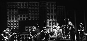 Pearl Jam performing in 2012. From left to right: McCready, Ament, Cameron, Vedder and Gossard.