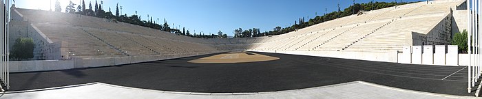 Panorama of a U-shaped stadium of white marble