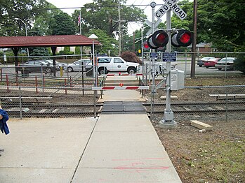 The pedestrian grade crossing at the station.