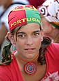 A Portuguese soccer fan wears a kerchief both as bandana and a expression of her club loyalty.