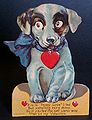 A grommet affixed to the center of the card permits the dog's eyes to glance side-to-side when the blue bow is moved