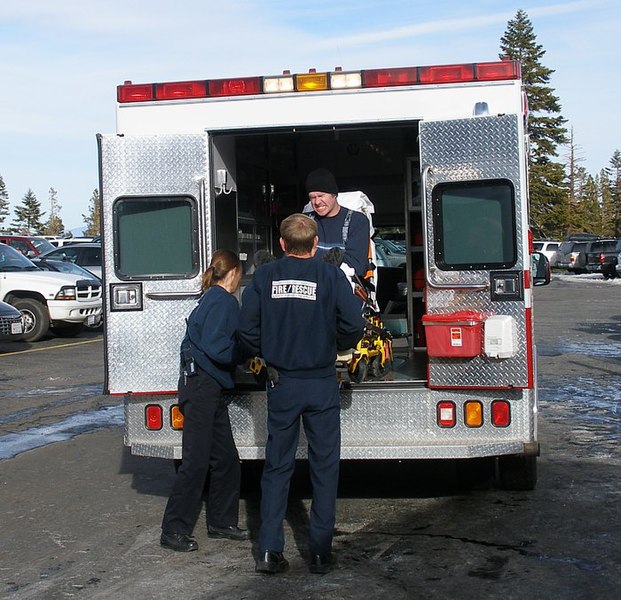 File:EMTs loading a patient.jpg