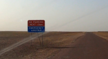 Donohue Highway Emergency Airstrip sign: "No parking next 1.5km. Emergency Airstrip"