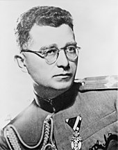 a black and white photograph of Draža Mihailović wearing glasses and Yugoslav Army dress uniform