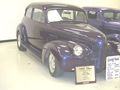 '40 Chev custom with painted grille, small front turnsignals, custom door mirror, and frenched radio aerial. Note non-stock one-piece windshield.