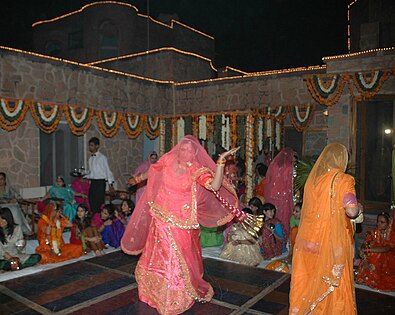 Women performing ghoomar at a wedding