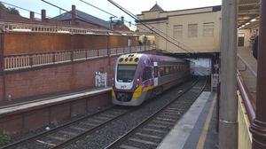 A VLocity train running through South Yarra station.