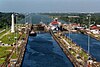 A canal tug, making its way down to the Caribbean end of the canal, waits to be joined by a ship in the uppermost chamber of the Gatun Locks.