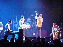 Keane performing live in Washington D.C, United States in 2009. From left to right: Tim Rice-Oxley, Jesse Quin, Tom Chaplin, Richard Hughes