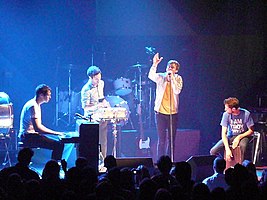 Keane performing live in Washington, D.C. in 2009. From left to right: Tim Rice-Oxley, Jesse Quin, Tom Chaplin, Richard Hughes