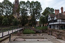 A concrete garden area incorporating ancient ruins