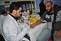 Bahrani man offering his blood for donation during Ashura