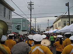 Second lining down Oak Street during the Po-Boy Festival