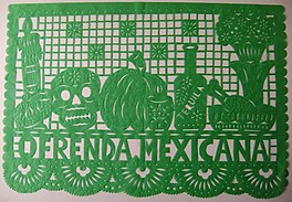 A picture of a green papel picado made for an oftenda