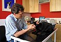 A veterinary surgeon in Cambridge, UK at work with a black cat