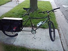 A Surly Big Dummy with handlebars and foot rests for a second rider