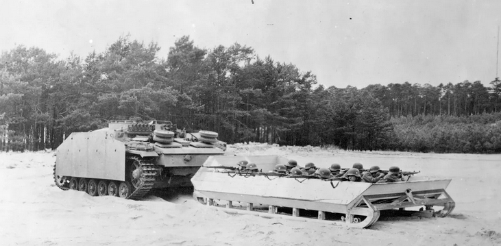 File:Stug III tows a sledge with infantry in training.jpg