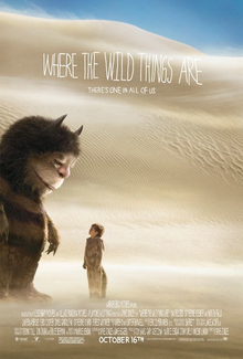 The Wild Thing named Carol towering over a small boy named Max, who is wearing a wolf suit.