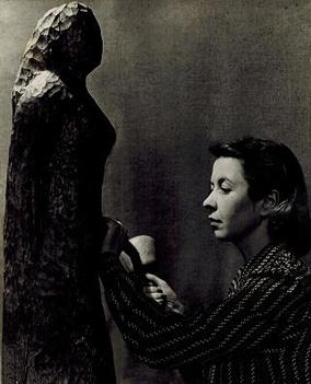 File:Sculptor Cleo Hartwig carving directly into wood.jpg