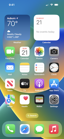 A picture of the iOS 16 home screen on an iPhone 13.