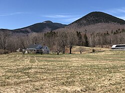 Mount Whiteface (L) and Mount Wonalancet rising over Ferncroft (April 2024)