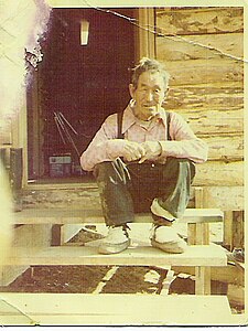 Crow Village Sam wearing his favorite mukluks, Chuathbaluk, Alaskaca, 1970