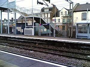 The eastbound platform and pedestrian bridge to the London-bound platform.