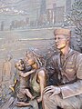 A sailor and his family, gazing eastward, over Lake Michigan. Detail of a sculpture at Soldier Field.