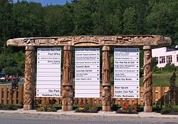 Welcome sign chainsaw-carved from cedar logs greets visitors to Concrete, Washington