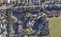 Aerial view of wetland surrounded by suburbs