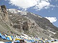 Tents are available to hire for a small fee near base of imposing Amarnath Cave as visible in background