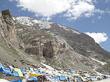 Tents are available to hire for a small fee near base of imposing Amarnath Cave as visible in background