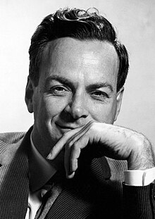 Feynman in a jacket and tie, smiling