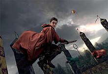 A scene from the film that accompanies the ride which features Harry Potter as portrayed by Daniel Radcliffe riding a broomstick.