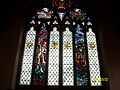 A close up of the stained glass library window