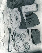 The murder kit includes a sports bag, garbage bags, ski mask, nylon stocking with holes, flashlight, crowbar, an awl, and some gloves.